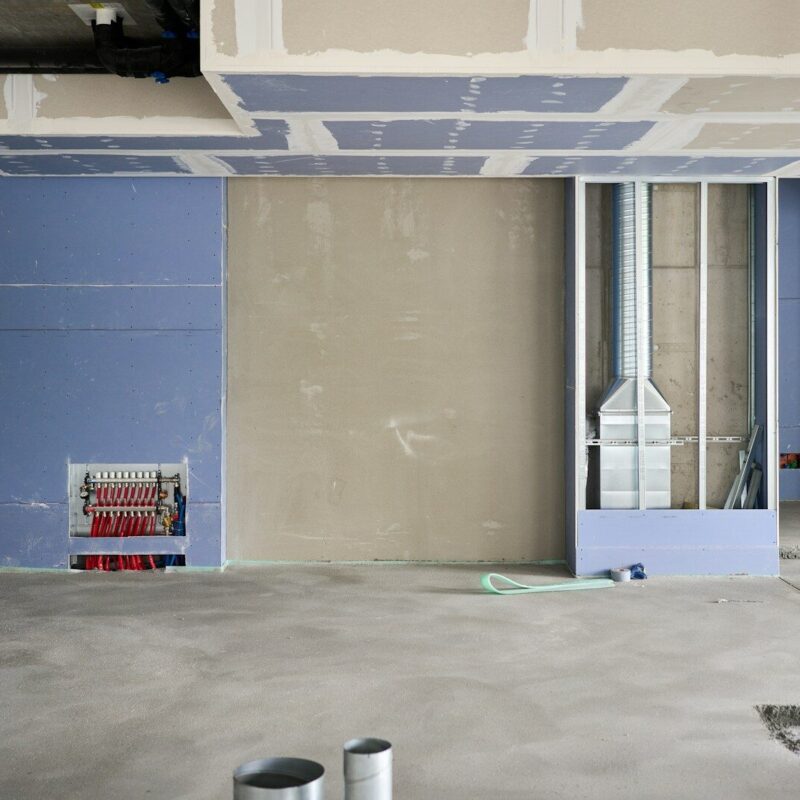 A room that has some paint on the floor